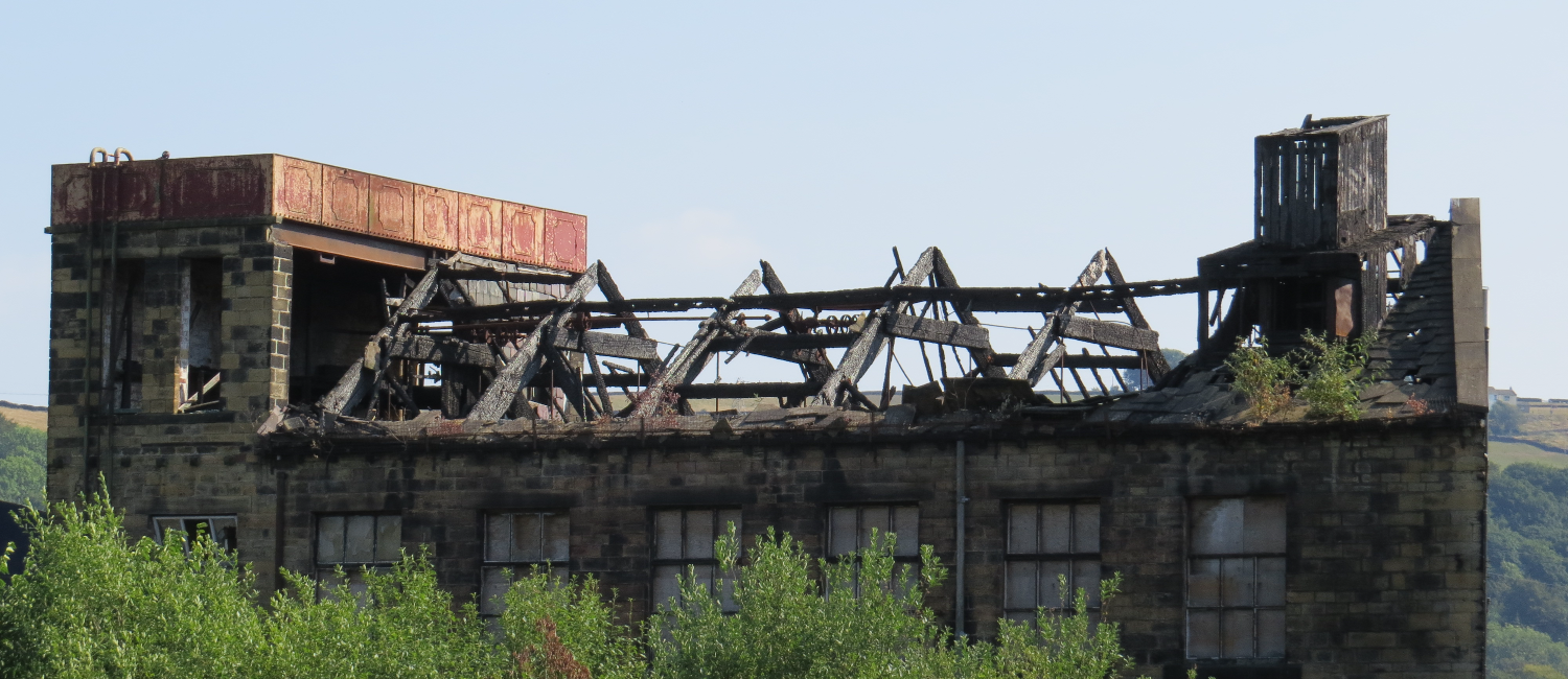 A run down building missing a roof