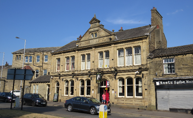 A sandy coloured building in Keighley town